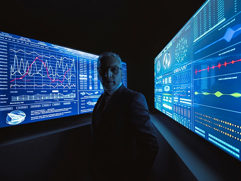 the-businessman-stands-near-the-big-blue-screen-wi-2026-01-06-08-57-41-utc (2)